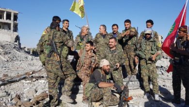 SDF and YBS fighters celebrate in Raqqa