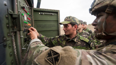 Romanian and US troops reposition a Patriot air defense missile launcher