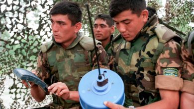 Uzbekistan soldiers inspect mines