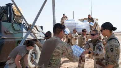 French and American forces offload supplies in Syria's Euphrates River Valley in May 2018
