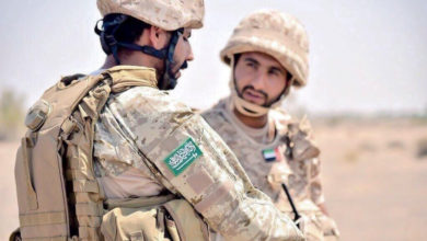 Saudi Arabia soldier talks to UAE soldier