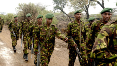 Kenya military personnel march in Nginyang Village