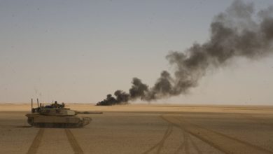 Chemical barrels are set ablaze by the Marines of 1st Tank Battalion during an operation outside Rawah, Iraq