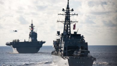 The Japan Maritime Self Defense Force Izumo-class helicopter destroyer JS Izumo and the Murasame-class destroyer JS Murasame