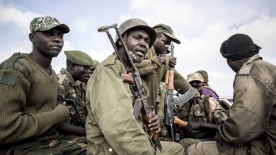 Soldiers of the Armed Forces of the Democratic Republic of the Congo (FARDC) prepare to escort health workers attached to ebola response programs on May 18, 2019 in Butembo, north of Kivu