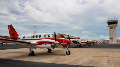 A line of Navy T-44C Pegasus' parked on the flightline aboard Naval Air Station Corpus Christi on July 23, 2019, in Texas