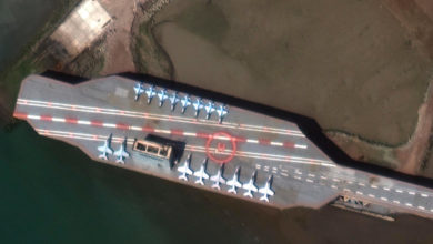 Satellite image obtained courtesy of Maxar Technologies shows a mockup aircraft carrier being prepared in the Iranian port of Bandar Abbas on February 15. Maxar Technologies/AFP