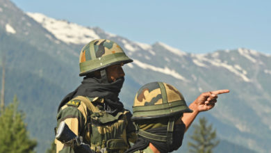 Indian Border Security Force (BSF) soldiers guard a highway leading towards Leh, bordering China, in Gagangir on June 17, 2020.