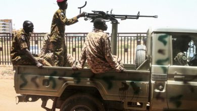 Sudanese soldiers seen in a convoy escorting Bashir back to prison after his appearance in court in Khartoum in August, 2019.