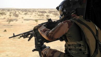 A French soldier aims his rifle at the target.