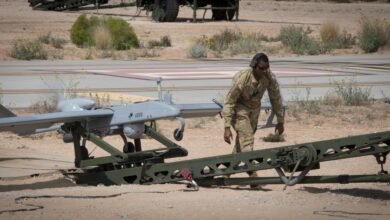 Photo of a Tactical Unmanned Aerial System maintainer with 3rd Squadron, 6th Cavalry Regiment, conducting final preflight checks during operational tests of the new RQ–7B Shadow Block III system at Fort Bliss, Texas