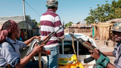 Ethiopian militias ride in the back of a pick up truck in Ethiopia, on 21 November 2020.