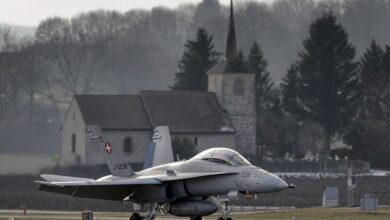 A Swiss Air Force F-18 is seen in front of a church on Feb. 20, 2013, at Payerne airport.