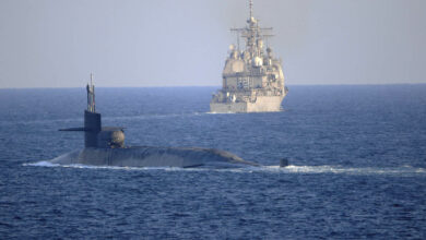 The Ohio-class guided-missile submarine USS Georgia (SSGN 729) transits with the Ticonderoga-class guided-missile cruiser USS Port Royal (CG 73) and the Ticonderoga-class guided-missile cruiser USS Philippine Sea (CG 58), not shown, in the Strait of Hormuz, December 21, 2020