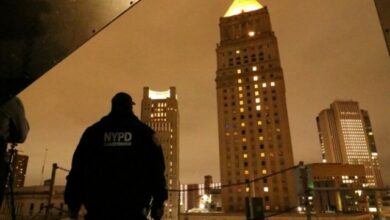 Detective Ralph Gonzalez, Counter Unmanned Aerial Systems Team Lead, New York City Police Department Counterterrorism Division, observes CUAS detection testing from a rooftop as Dense Urban CUAS Materiel Experiment 21-1 was underway in lower Manhattan on October 24