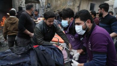 Rescue workers carry away a victim at the scene of an explosion in the town of Azaz in the rebel-controlled northern countryside of Syria’s Aleppo province, January 31, 2021.