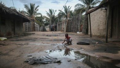 A child plays in an alley at the Port of Paquitequete near Pemba, March 29, 2021, where sailing boats are expected to arrive with people displaced from the coasts of Palma and Afung