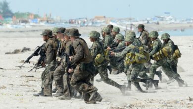 The Philippine and US Marines taking positions during a beach assault exercise facing the South China Sea in San Antonio, Zambales province on May 9, 2014