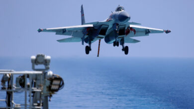 plane landing on an aircraft carrier