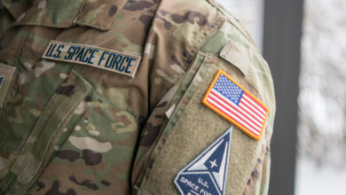 Space Force Staff Sgt. David Diehl II, 436th Communications Squadron noncommissioned officer in charge of wing cybersecurity, displays his new uniform Space Force tapes and service branch patch at Dover Air Force Base, Del., Feb. 12, 2021.