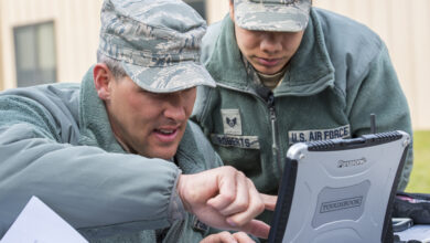 US Air Force Tech. Sgt. Cory Hebb, left, 820th Base Defense Group NCO in charge of Innovative Combat Equipment, and Staff Sgt. Rodshede Roberts, 820th Combat Operations Squadron technologies NCO, locate an RQ-11B Raven via GPS signal at Moody Air Force Base