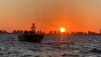 The Unmanned Influence Sweep System (UISS) heads offshore at sunrise for an Operational Assessment mission off the coast of South Florida in November 2019