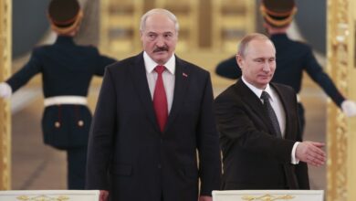 Russia's President Vladimir Putin and his Belarus' counterpart Alexander Lukashenko walk in as they attend a session of the Supreme State Council of the Union State at the Kremlin in Moscow on March 3, 2015.