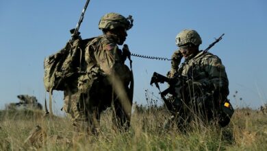 A U.S. Soldier assigned to 2d Cavalry Regiment (2CR) listens to radio communication during Dragoon Ready at the 7th Army Training Command's Grafenwoehr Training Area, Germany, Oct. 16, 2018.