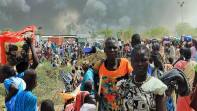 South Sudanese civilians flee fighting in the northeastern town of Malakal, where gunmen opened fire on people sheltering inside a United Nations base