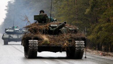Ukrainian tanks move on a road