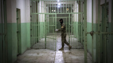 A member of the Syrian Democratic Forces serving guard in a prison in al-Hasakah province in northeastern Syria