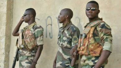 Malian Defense Forces soldiers look on in Timbuktu
