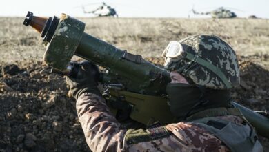 A Ukrainian soldier aims with an anti-aircraft launcher
