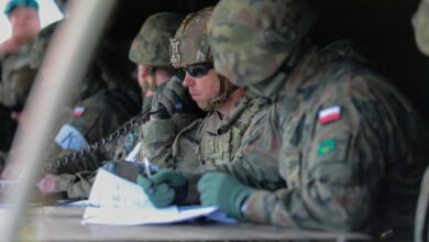 US Army major communicating during DEFENDER 2022 exercise in Poland