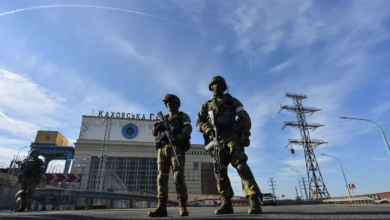 Russian servicemen patrolling at the Kakhovka Hydroelectric Power Plant, Kherson
