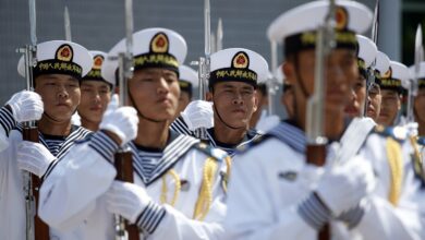 China's Peoples' Liberation Army Navy sailors march