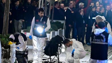 Investigators work after an explosion of unknown origin shook the busy shopping street of Istiklal in Istanbul