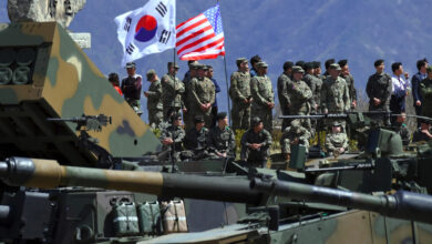 South Korean and US soldiers watching from an observation post during a joint live firing drill