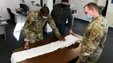 ICBM Technical engineers from the Air Force Nuclear Weapons Center out of Hill Air Force Base, Utah, look over documents that will allow them to help the 90th Maintenance Group with any problems they come across, Dec. 7, 2021, at F.E Warren AFB, Wyoming. The technical engineering squadron at Hill AFB, Utah has an office located at F.E Warren AFB, Wyoming in order to provide the local maintenance squadron with the help they need to complete their day-to-day mission. (U.S. Air Force photo by Airman Sarah Post)