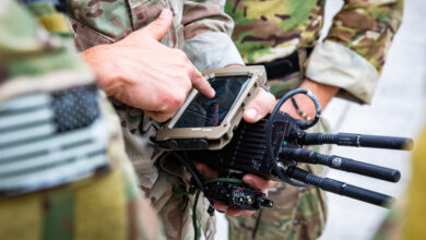 Soldiers from U.S. Army Special Operations Command train with devices connected via the Defense Advanced Research Projects Agency (DARPA) Secure Handhelds on Assured Resilient networks at the tactical Edge (SHARE) system in preparation for their employment during Project Convergence 22. PC22 is an All-Service and Multinational campaign of learning featuring experiments on hundreds of different technologies and capabilities. (U.S. Army photo by CPT Alex Werden)