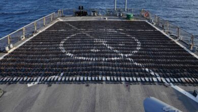 Thousands of AK-47 assault rifles sit on the flight deck of guided-missile destroyer USS The Sullivans during an inventory process, January 7, 2023