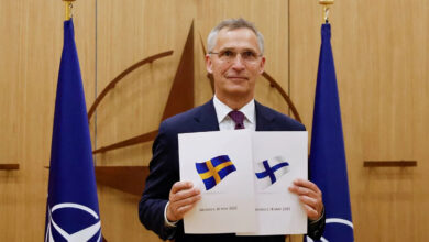 NATO Secretary-General Jens Stoltenberg holds application documents presented by Finland and Sweden
