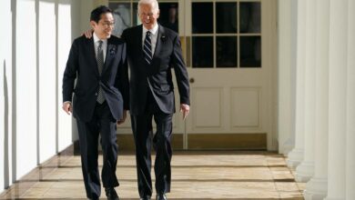 US President Joe Biden and Prime Minister Fumio Kishida walk through the colonnade of the White House in Washington