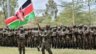 Kenya Defense Forces soldiers attend a flag presentation ceremony