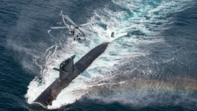 210816-N-GR718-0701 SAN DIEGO (Aug. 16, 2021) An MH-60R assigned to the “Seahawks'' of Helicopter Maritime Strike Squadron (HSM) 41 flies over a Chilean Navy Scorpene Class Submarine during Diesel-Electric Submarine Initiative Hoist Exercise 2021 (DESI HOISTEX). DESI is a multinational exercise designed to strengthen partnerships and enhance capabilities among partner nations. (U.S. Navy Photo by Mass Communication Specialist 2nd Class Chelsea D. Meiller)