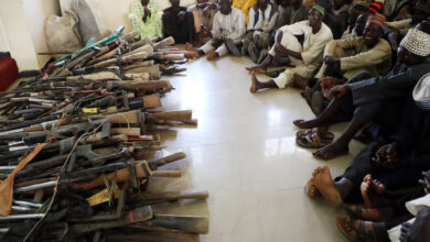 A stash of Kalashnikovs and locally made hunting rifles surrendered by a local vigilante group in Zamfara State, northwest Nigeria