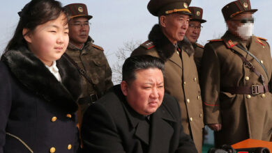 North Korea's leader Kim Jong Un and his daughter observing a warhead missile launch exercise simulating a tactical nuclear attack