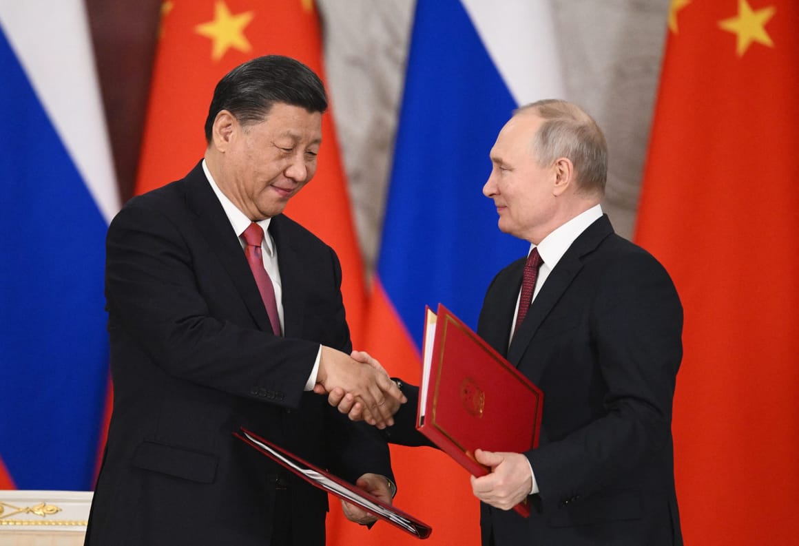 Russian President Vladimir Putin and China's President Xi Jinping shake hands during a signing ceremony following their talks at the Kremlin in Moscow on March 21, 2023