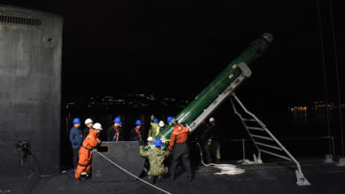 191018-N-UN744-1259 - HAAKONSVERN NAVAL BASE, Norway (Oct. 18, 2019) - Sailors assigned to the Virginia-class, nuclear-powered, fast-attack submarine USS Minnesota (SSN 783) work alongside Norwegian crane operators to guide an MK-48 Advanced Capability torpedo into the submarine during an ordnance onload at the Haakonsvern Naval Base in Bergen, Norway, Oct. 18, 2019. Minnesota, the 10th ship of the Virginia class, is on a regularly scheduled deployment in the U.S. 6th Fleet area of operations in support of U.S. national security interests in Europe and Africa. (U.S. Navy photo by Chief Mass Communication Specialist Travis Simmons)