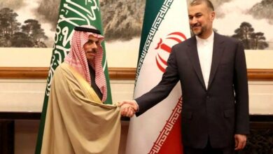 Iran's Foreign Minister Hossein Amirabdollahian (R) and Saudi Foreign Affairs Minister Prince Faisal bin Farhan Al-Saud (L) meeting in Beijing, China, April 6